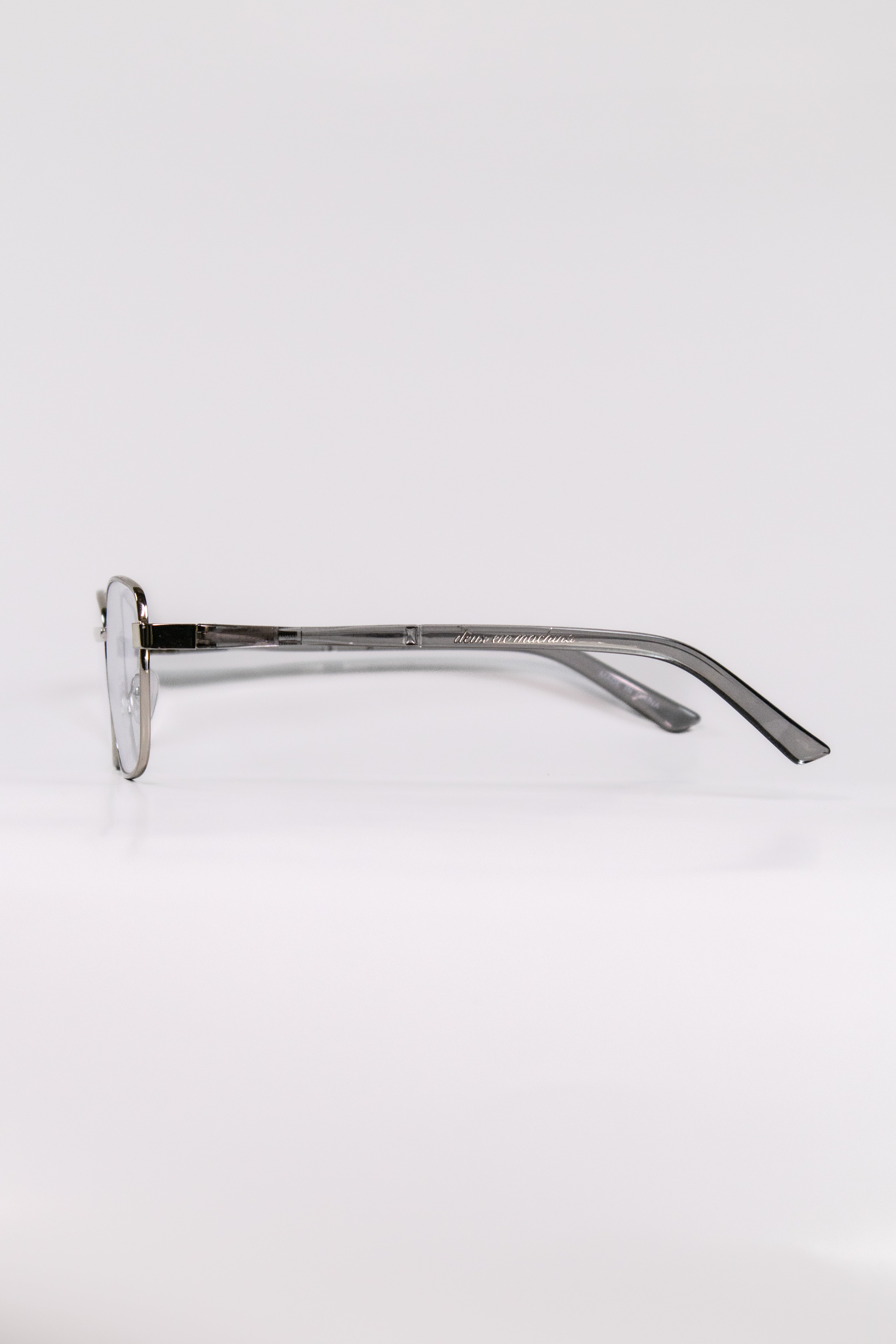 Side shot of a pair of silver glasses with metal frames